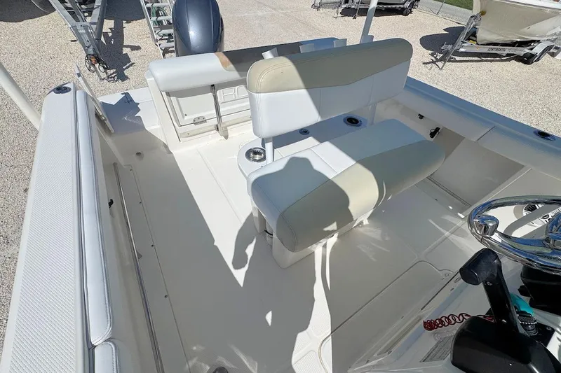 Slide: The Image of 2016 Robalo R222 Center Console boat interior with seating and steering wheel. - 8