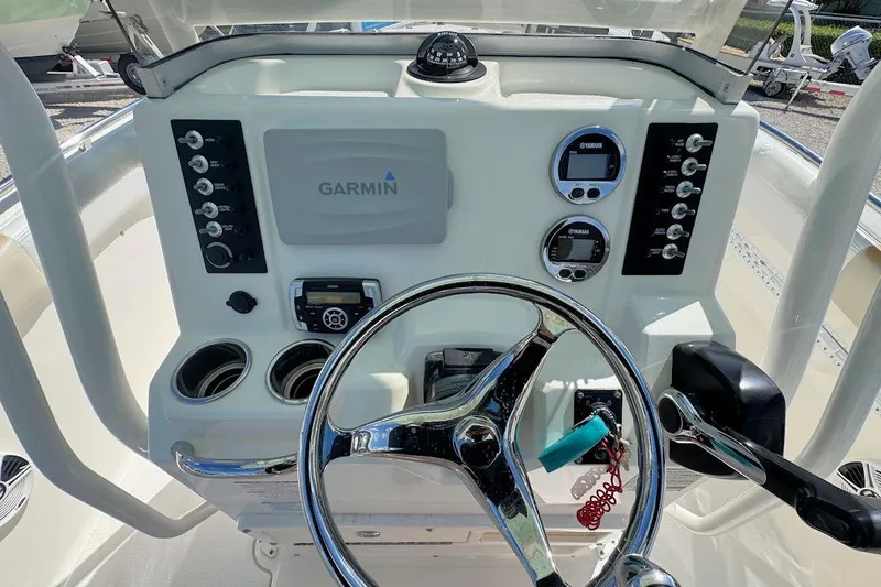 Slide: The Image of 2016 Robalo R222 Center Console dashboard with Garmin navigation and Yamaha controls. - 9