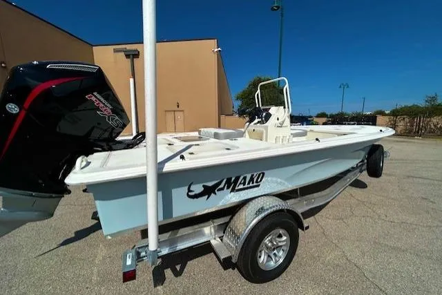 Slide: The Image of 2026 Mako 18 Pro Skiff boat on trailer, outdoor setting, clear sky. - 2