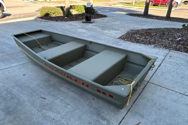Slide: The Image of 2026 Tracker Grizzly 10 Jon boat on concrete surface, featuring durable design and spacious interior. - 3