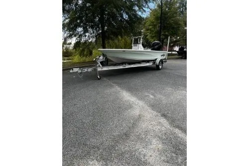 The Image of 2026 Mako 18 Pro Skiff boat on trailer, parked outdoors. - 0