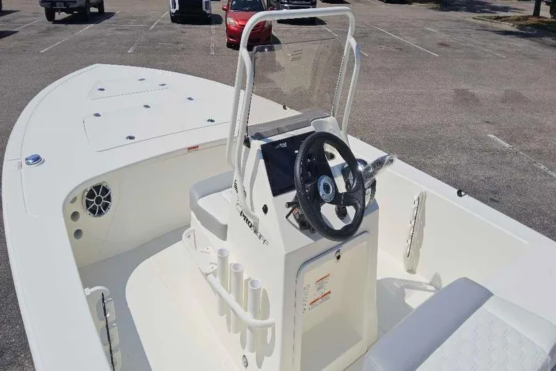 Slide: The Image of 2026 Mako Pro Skiff 18 boat interior with steering console and seating. - 4