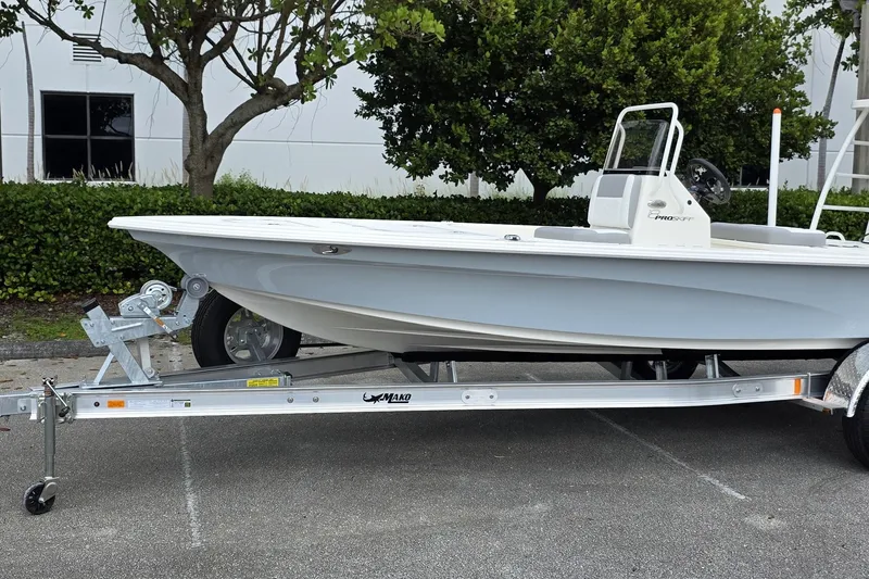 The Image of 2026 Mako 18 Pro Skiff boat on trailer, parked outdoors. - 0