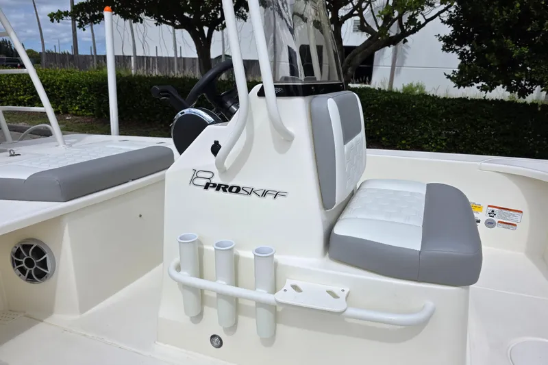 Slide: The Image of 2026 Mako 18 Pro Skiff boat interior with seating and console details. - 3
