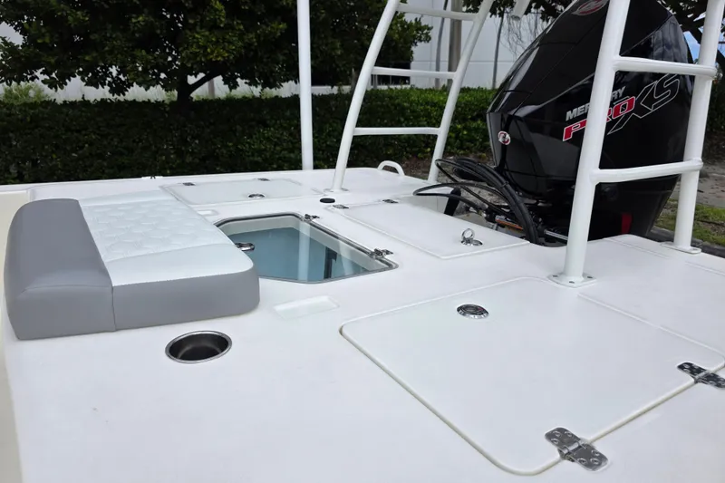 Slide: The Image of 2026 Mako 18 Pro Skiff boat deck with seating and Mercury Pro XS engine. - 4