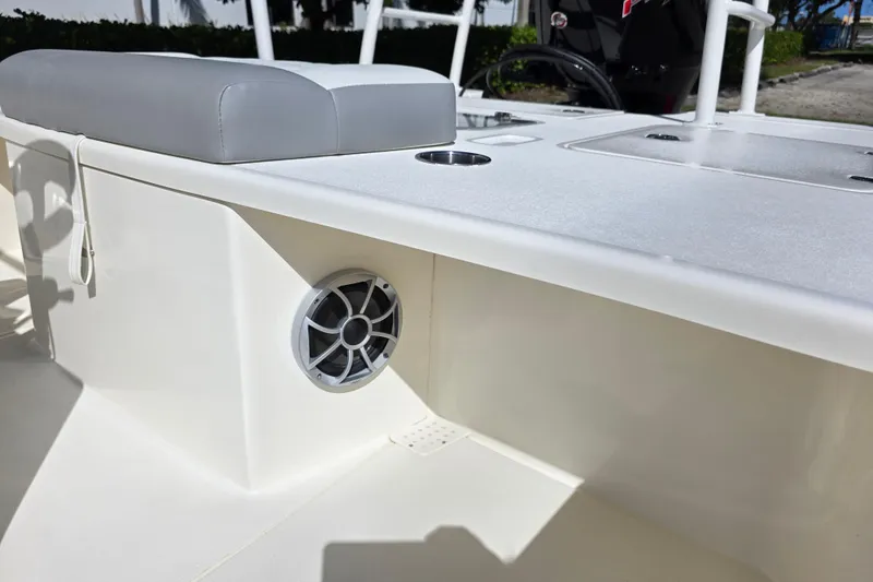 Slide: The Image of 2026 Mako 18 Pro Skiff boat interior with speaker and seating detail. - 9