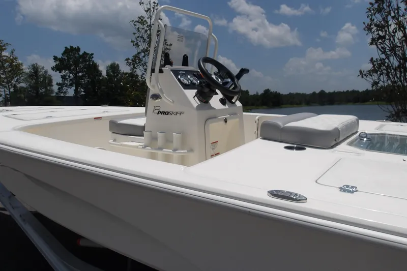 Slide: The Image of 2026 Mako 18 Pro Skiff boat with sleek design, white interior, and modern console. - 16