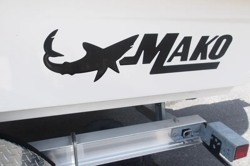 Slide: The Image of 2026 Mako 18 Pro Skiff logo on boat trailer, featuring shark silhouette. - 15