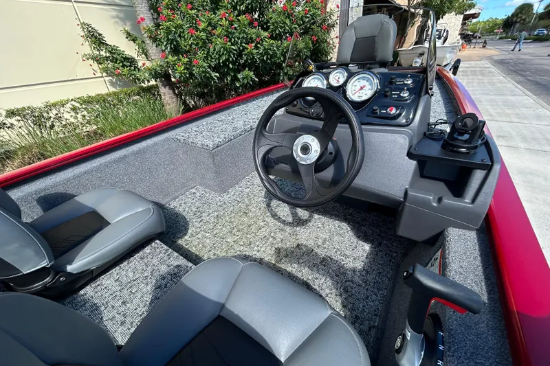 Slide: The Image of 2026 Tracker Pro 170 boat interior with steering wheel and dashboard controls. - 3