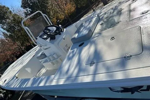 Slide: The Image of 2026 Mako 18 Pro Skiff boat with spacious deck and steering console. - 54