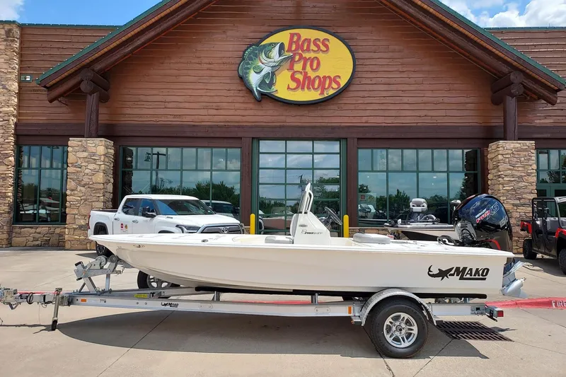 The Image of 2026 Mako Pro Skiff 18 boat on trailer outside Bass Pro Shops. - 0