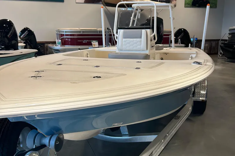 The Image of 2026 Mako 18 Pro Skiff boat on trailer outside Tracker Boats store. - 0