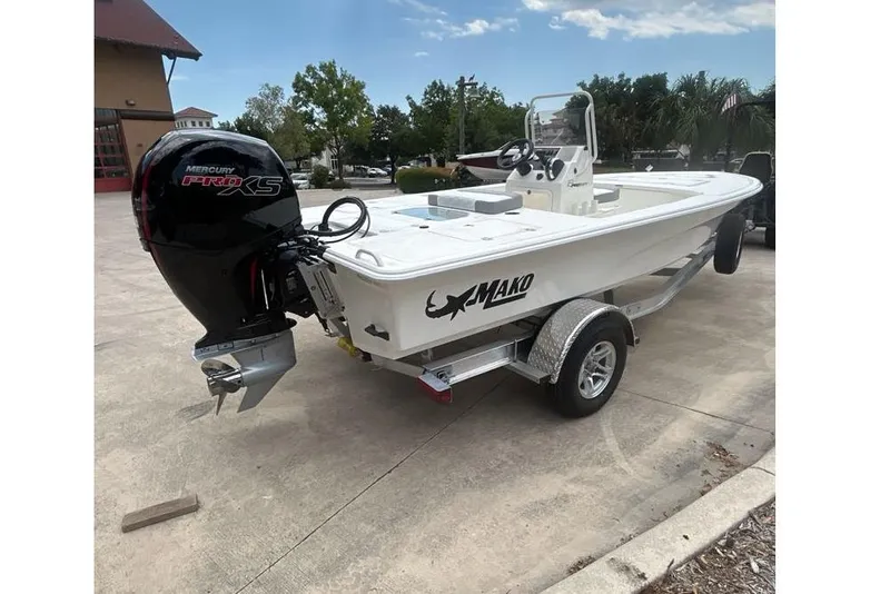 Slide: The Image of 2026 Mako Pro Skiff 18 boat on trailer with Mercury Pro XS outboard motor. - 55