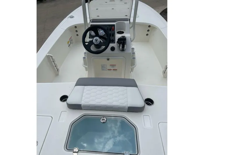 Slide: The Image of 2026 Mako Pro Skiff 18 boat interior with steering console and seating. - 57