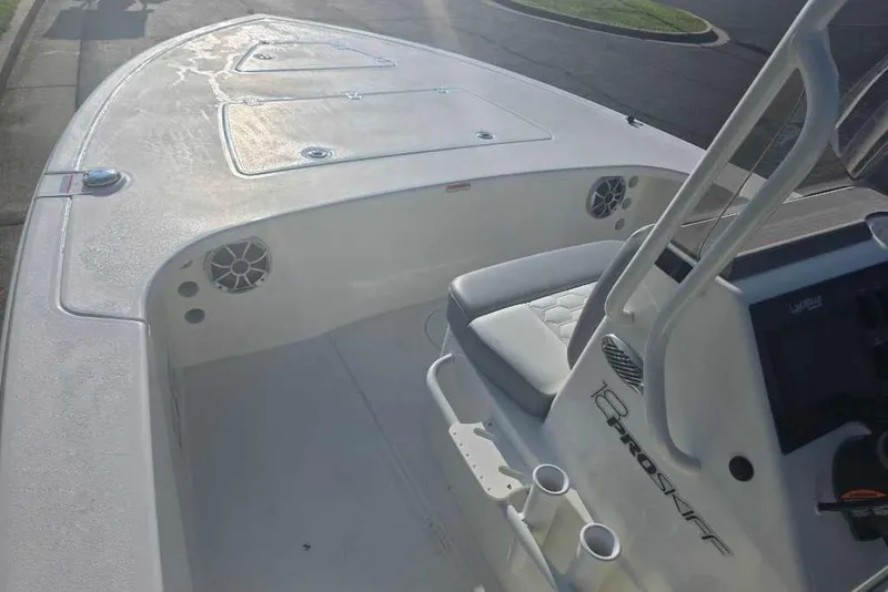Slide: The Image of 2026 Mako 18 Pro Skiff boat interior with seating and console. - 8
