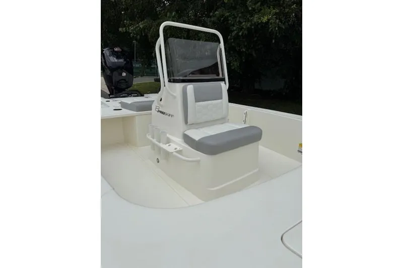Slide: The Image of 2026 Mako 18 Pro Skiff boat interior with seating and console. - 8