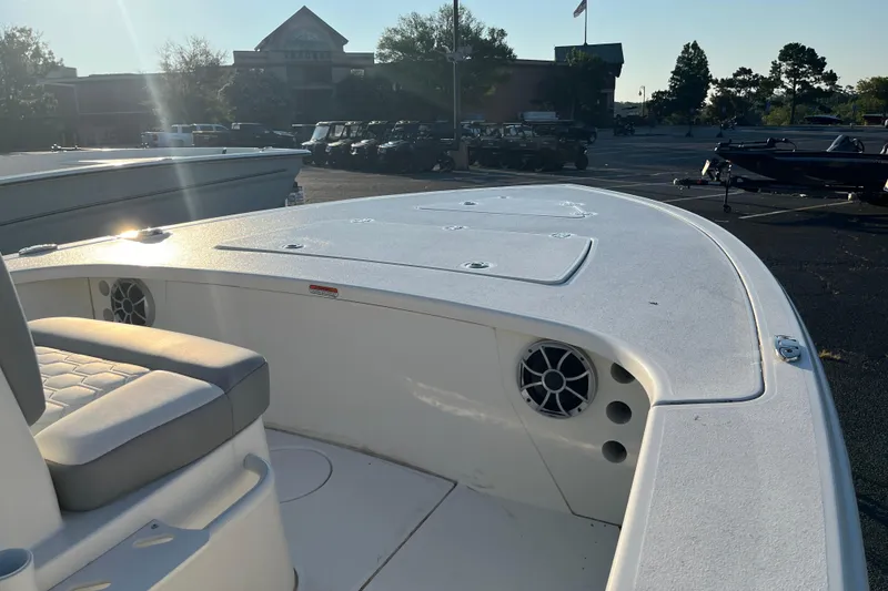 Slide: The Image of 2026 Mako 18 Pro Skiff boat deck with seating and storage compartments. - 5
