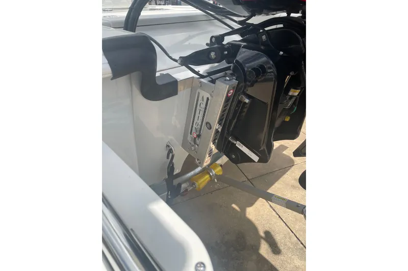 Slide: The Image of 2026 Mako 18 Pro Skiff boat engine mount detail in sunlight. - 10