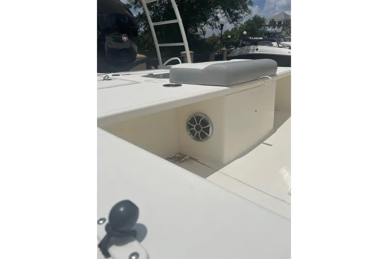 Slide: The Image of 2026 Mako 18 Pro Skiff boat interior with seating and speaker detail. - 11
