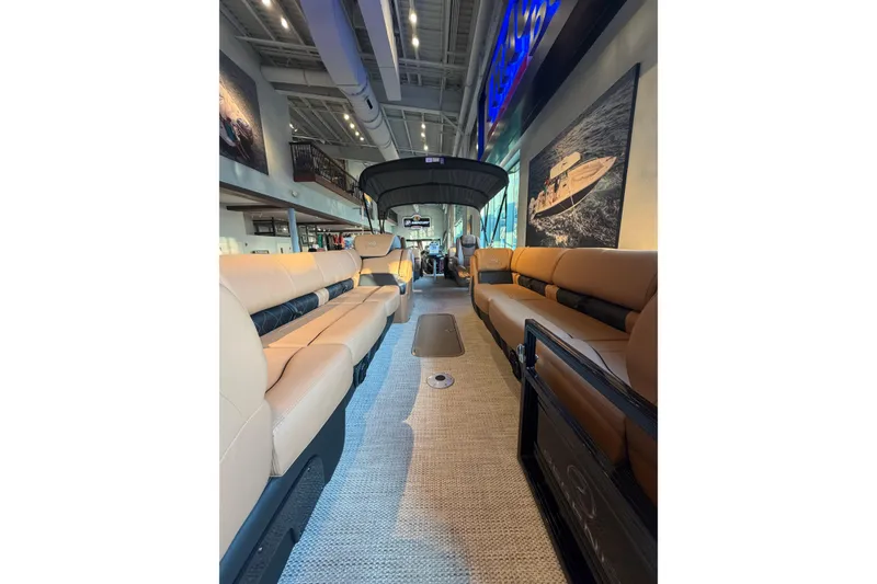Slide: The Image of Luxurious interior of 2025 Regency 250 LE3 pontoon boat with plush seating and modern design. - 1
