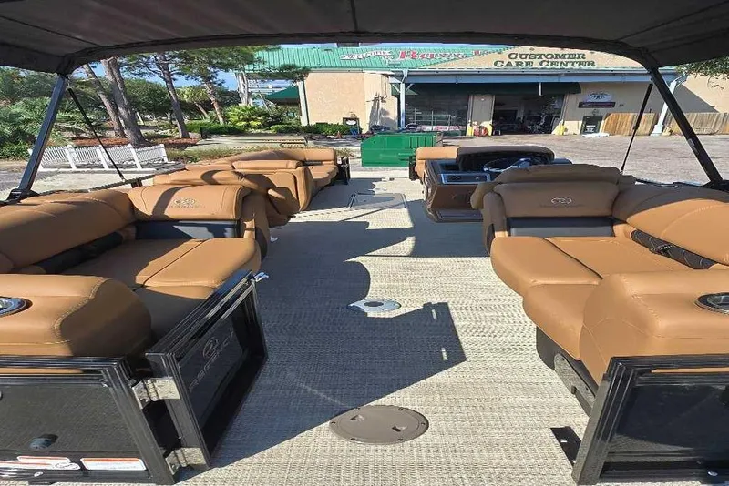 Slide: The Image of 2025 Regency 250 LE3 boat dashboard with steering wheel and control panel. - 2