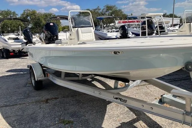Slide: The Image of 2026 Mako 18 Pro Skiff boat on trailer, displayed outdoors under clear sky. - 3