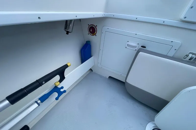 Slide: The Image of Interior of 2021 Steiger Craft 255 Chesapeake boat with storage and equipment. - 15