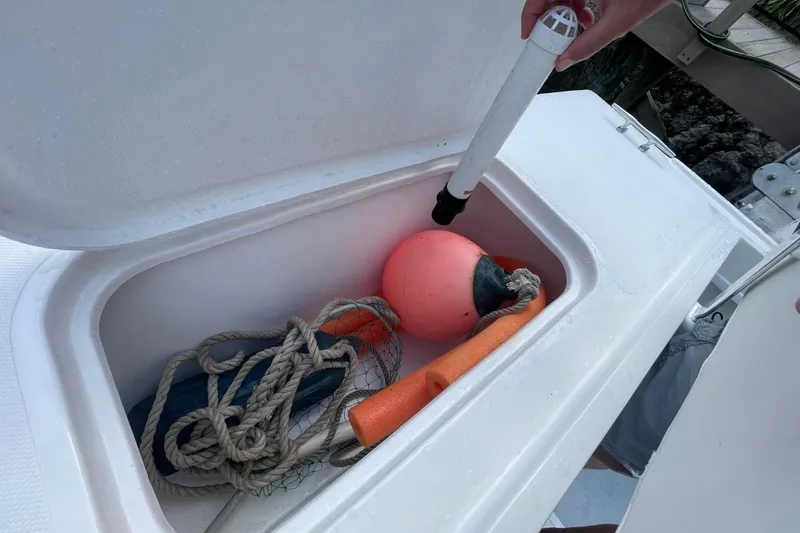 Slide: The Image of Storage compartment on 2021 Steiger Craft 255 Chesapeake with marine equipment and buoy. - 17