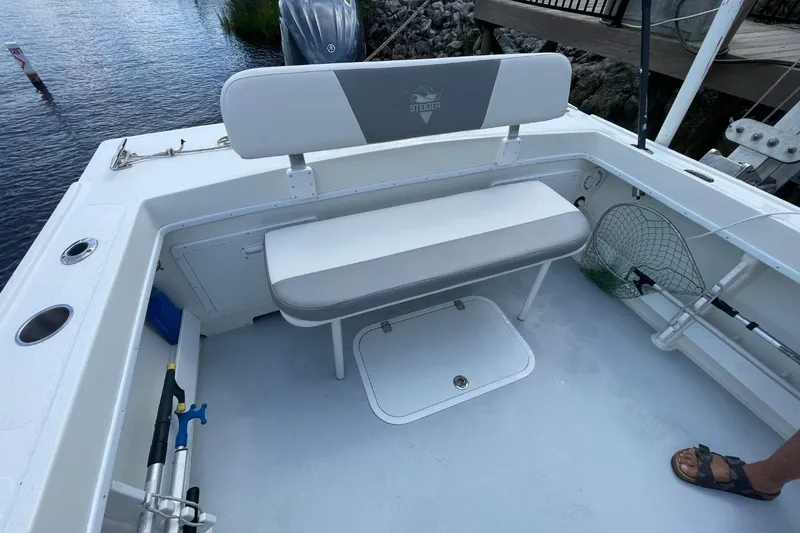 Slide: The Image of 2021 Steiger Craft 255 Chesapeake boat interior with seating and fishing gear. - 18
