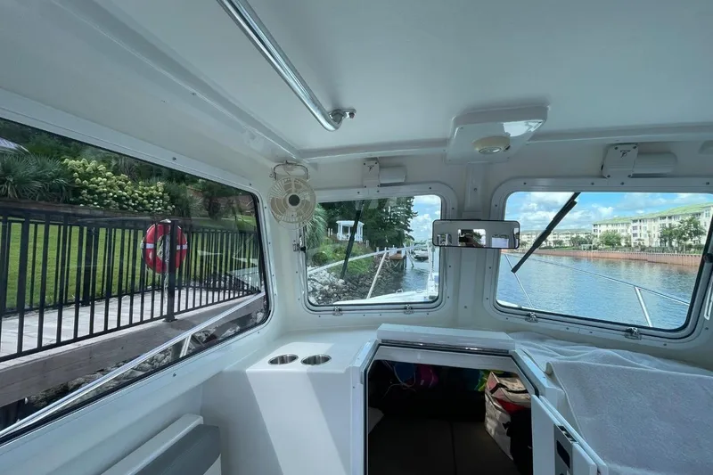 Slide: The Image of Interior view of 2021 Steiger Craft 255 Chesapeake boat with waterfront scenery. - 20
