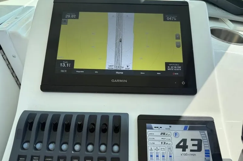 Slide: The Image of Steiger Craft 255 Chesapeake 2021 dashboard with Garmin navigation and control panel. - 23