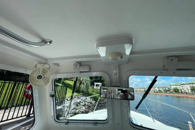 Slide: The Image of Interior view of 2021 Steiger Craft 255 Chesapeake boat with windows and fan. - 28