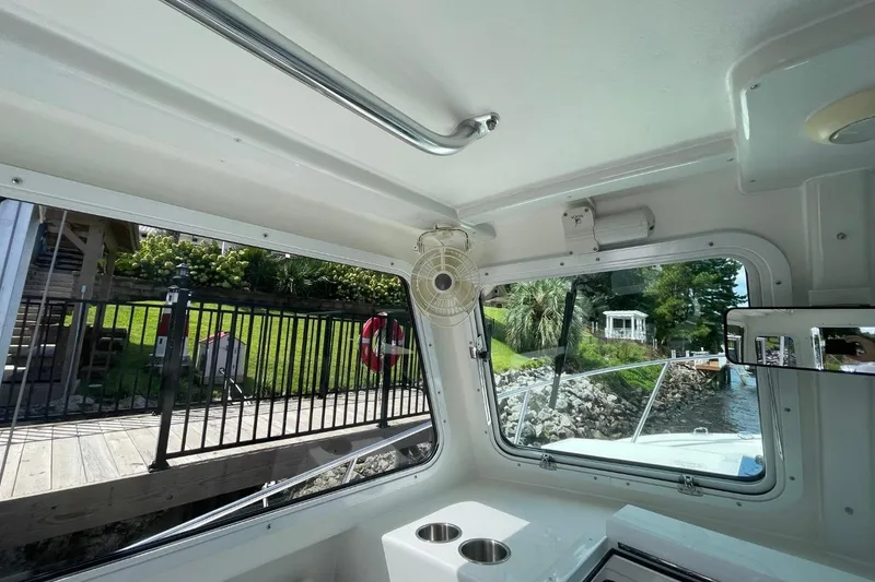 Slide: The Image of Interior view of 2021 Steiger Craft 255 Chesapeake boat with windows and fan. - 29