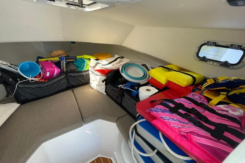 Slide: The Image of Interior of 2021 Steiger Craft 255 Chesapeake boat with organized storage and safety gear. - 30
