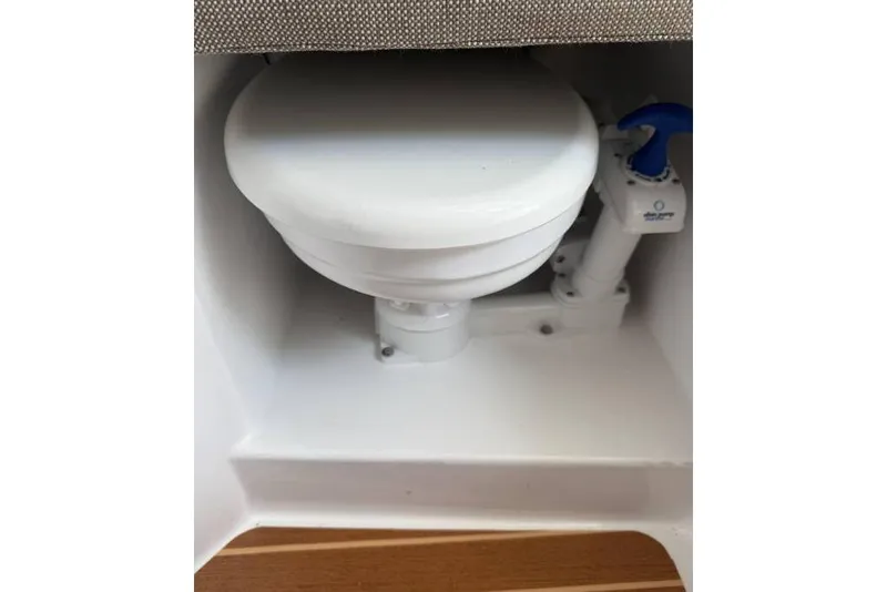 Slide: The Image of 2021 Steiger Craft 255 Chesapeake marine toilet with manual pump handle. - 33