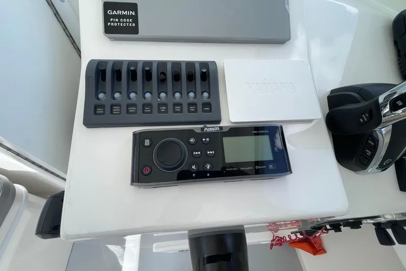 Slide: The Image of Control panel of 2021 Steiger Craft 255 Chesapeake with Garmin and Fusion audio system. - 34