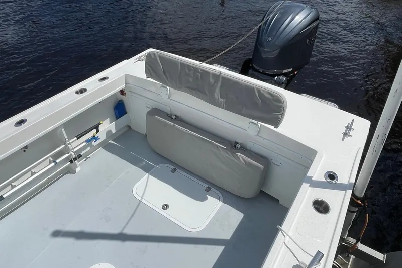 Slide: The Image of 2021 Steiger Craft 255 Chesapeake boat deck with seating and outboard motor. - 39