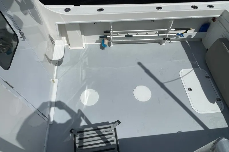 Slide: The Image of 2021 Steiger Craft 255 Chesapeake boat deck with storage and rod holders. - 40