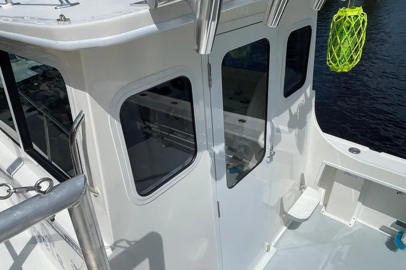 Slide: The Image of 2021 Steiger Craft 255 Chesapeake boat with white cabin and water view. - 41