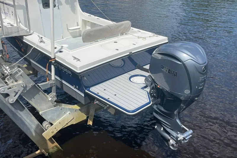 Slide: The Image of 2021 Steiger Craft 255 Chesapeake boat with Yamaha outboard motor on water. - 5