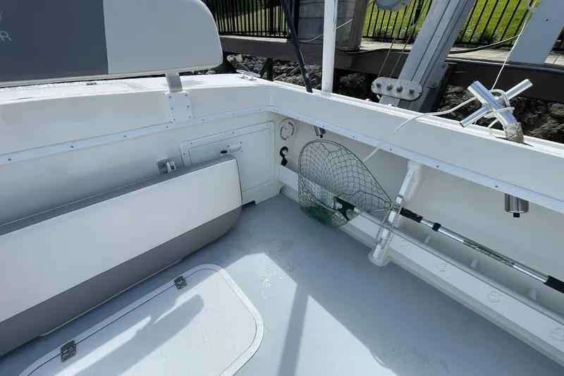 Slide: The Image of 2021 Steiger Craft 255 Chesapeake boat interior with fishing gear and seating. - 6