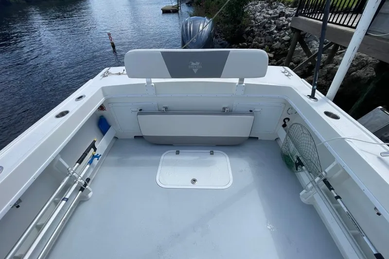 Slide: The Image of 2021 Steiger Craft 255 Chesapeake boat deck with fishing gear and seating. - 8