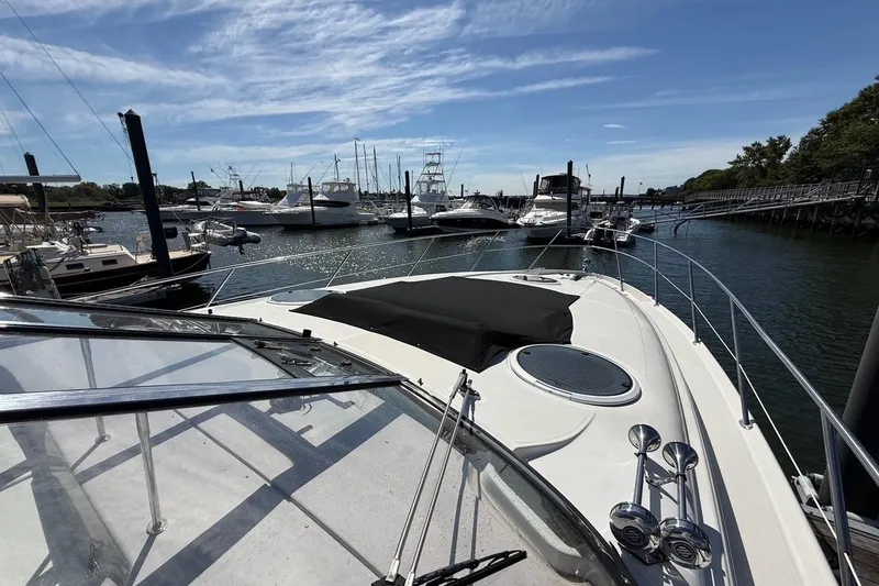 Slide: The Image of 2001 Regal Commodore 4160 yacht docked in a marina under a clear blue sky. - 15