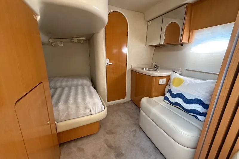 Slide: The Image of 2001 Regal Commodore 4160 cabin interior with bed, sink, and seating area. - 20