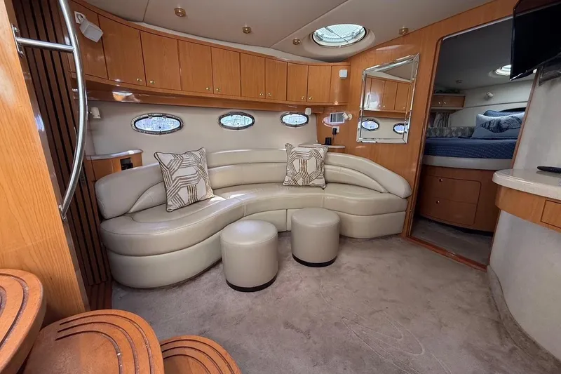 Slide: The Image of Luxurious interior of 2001 Regal Commodore 4160 yacht with leather seating and wooden cabinetry. - 22
