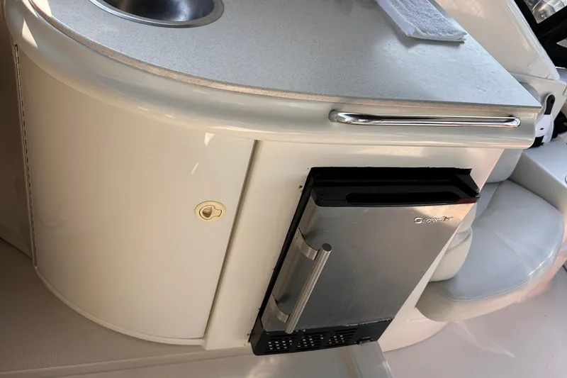 Slide: The Image of 2001 Regal Commodore 4160 yacht kitchenette with sink and compact fridge. - 8