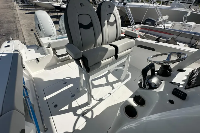 Slide: The Image of 2026 Sea Pro 262 Center Console boat interior with dual seats and steering console. - 10