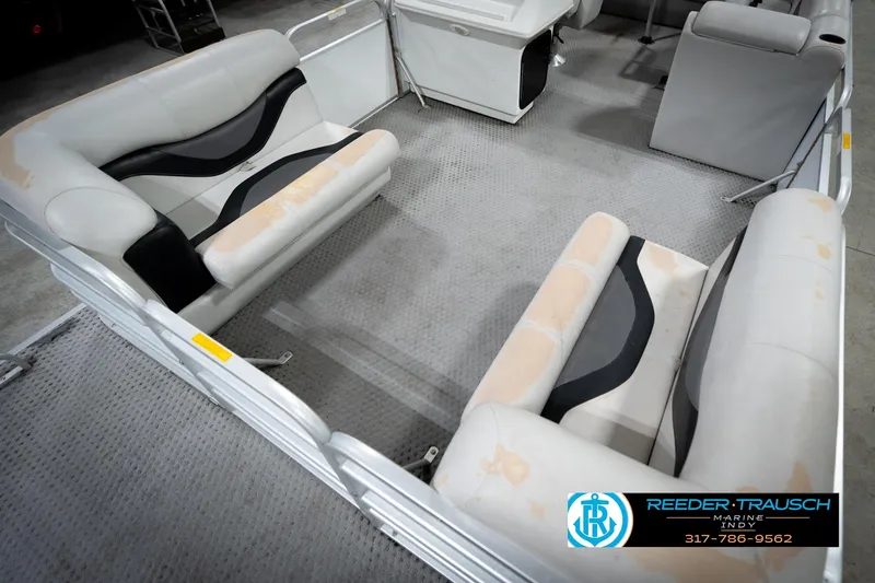 Slide: The Image of 1991 Godfrey Sanpan SP 2200 pontoon boat in indoor storage facility. - 11