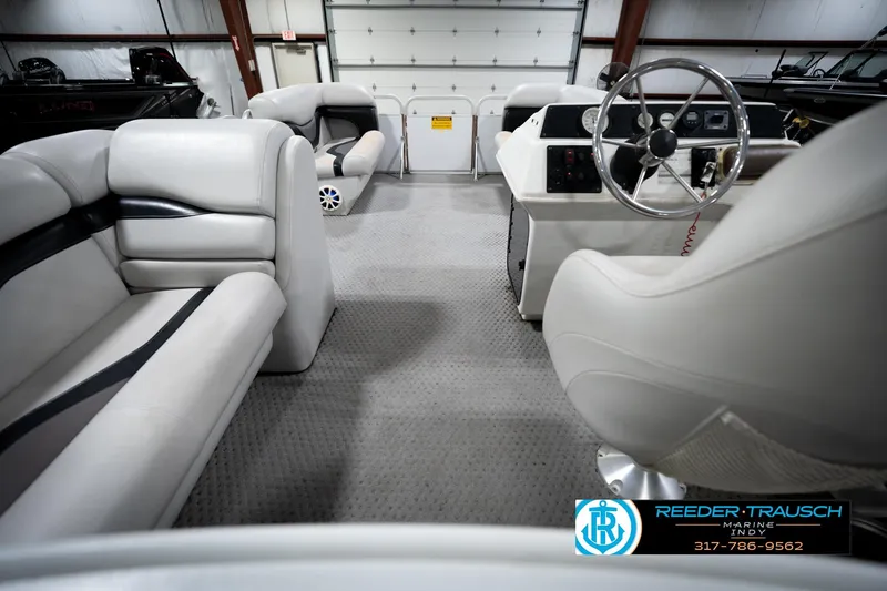 Slide: The Image of Interior of 1991 Godfrey Sanpan SP 2200 pontoon boat with seating and table. - 18