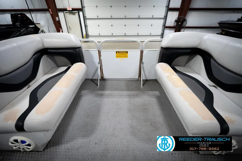 Slide: The Image of Interior of a 1991 Godfrey Sanpan SP 2200 pontoon boat with white seating. - 20